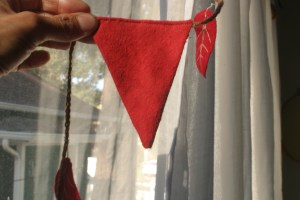 Houseproud homestead project - view of front of flag sewn onto red flannel flag garland.