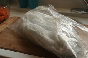 Tuck the towel-wrapped leafy herbs and greens in a plastic bag (don't close the bag with a twist tie).
