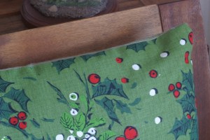 One of a pair of zippered throw pillow covers that I made this year.  The holly fabric was an Oakland White Elephant Sale (OWES) score a few years ago - it looks and feels like it's from the late 50s or early 60s, but as there's no info on the selvage edge its true age is a mystery.  The back is made of some soft green flannel that I suspect I purchased at OWES last year (I really ought to keep track of such things).  The only brand-new components were the zippers.  Off all the things I made this winter, these pillow cases were the easiest (up to and including installing the zippers).   