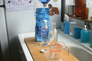 Hot simple syrup in glass bottles.  I made this batch of syrup stronger than I normally do - it's a 1:1 ratio (2 cups of water to 2 cups of sugar).  Because the syrup is strong, I won't have to use as much of it when I bottle up my kombucha for its secondary fermentation.  